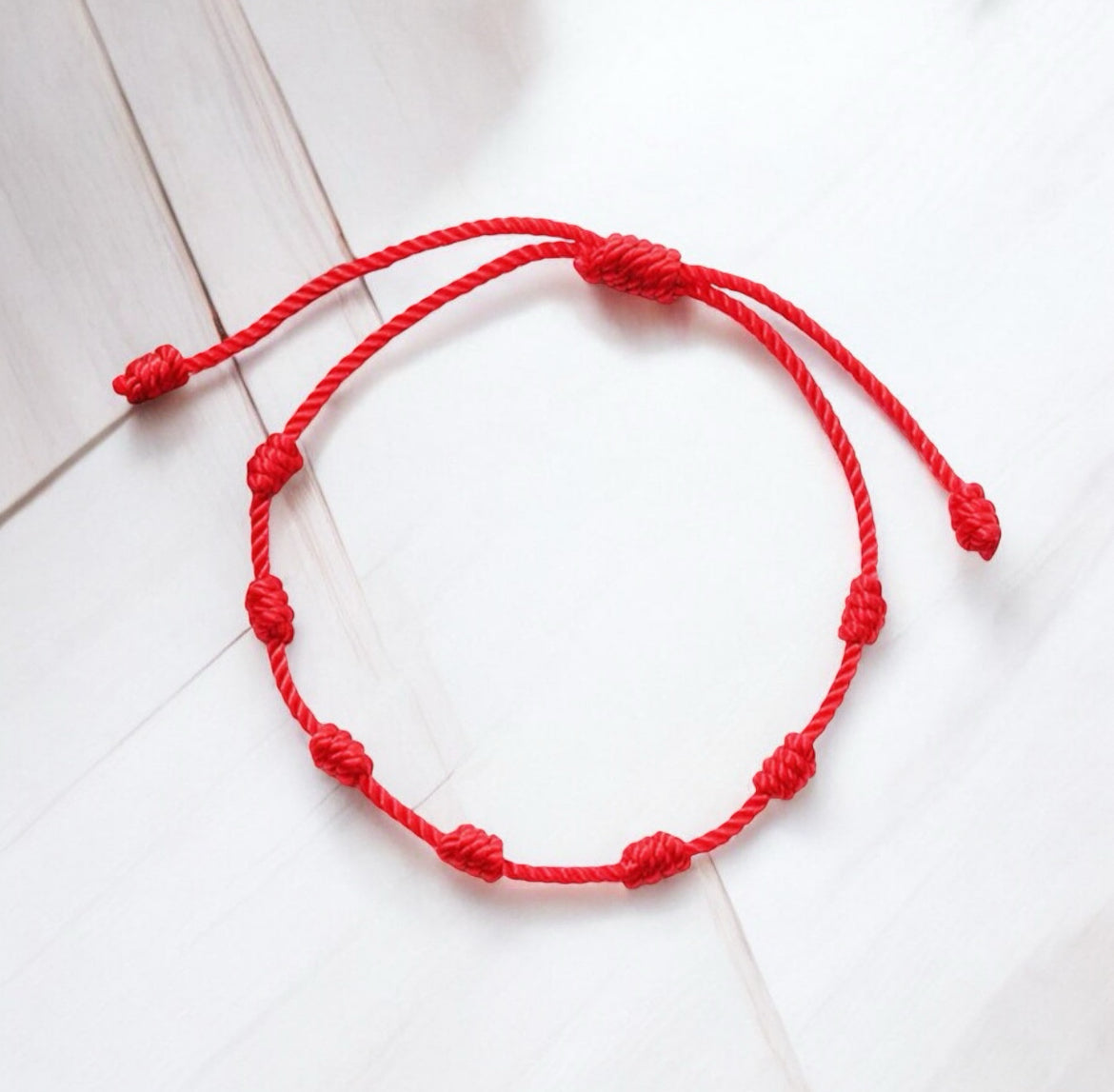 7 knots red cord bracelet