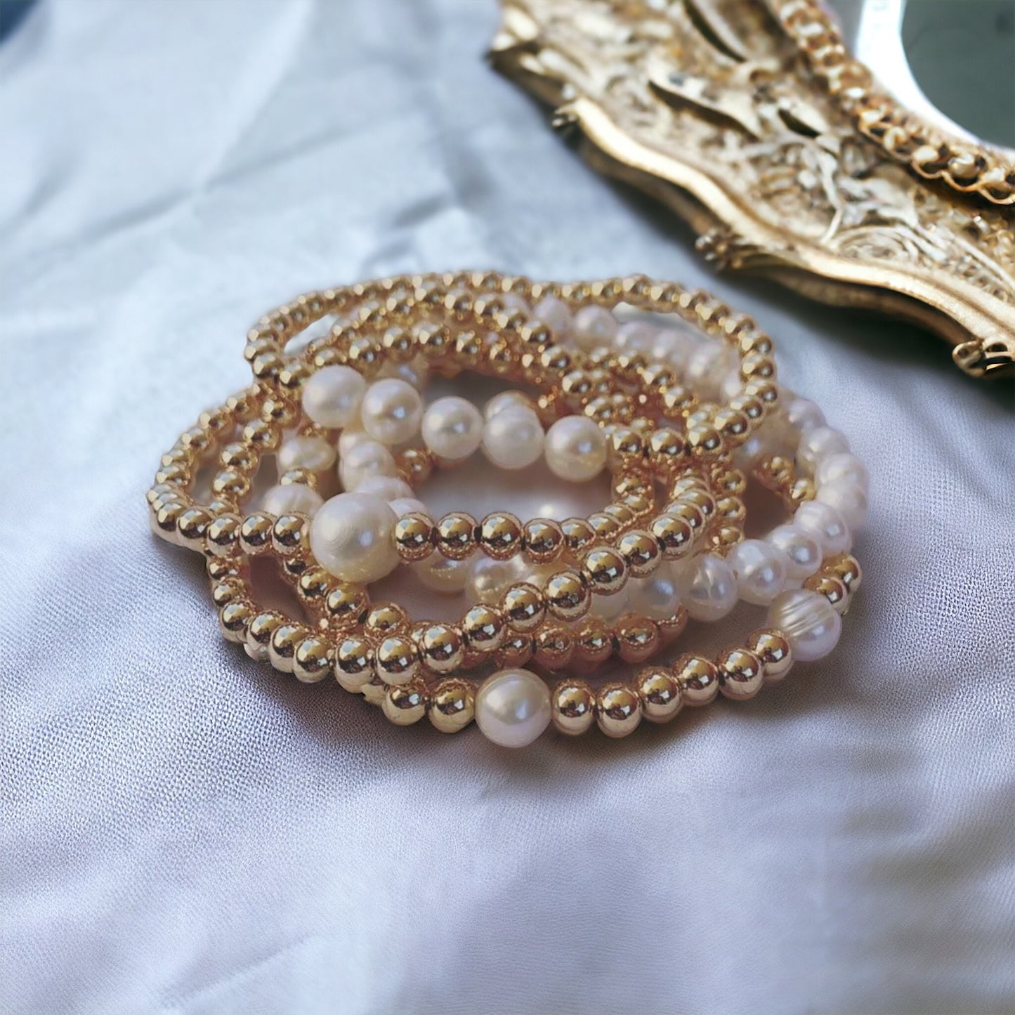 Stack of gold bracelets