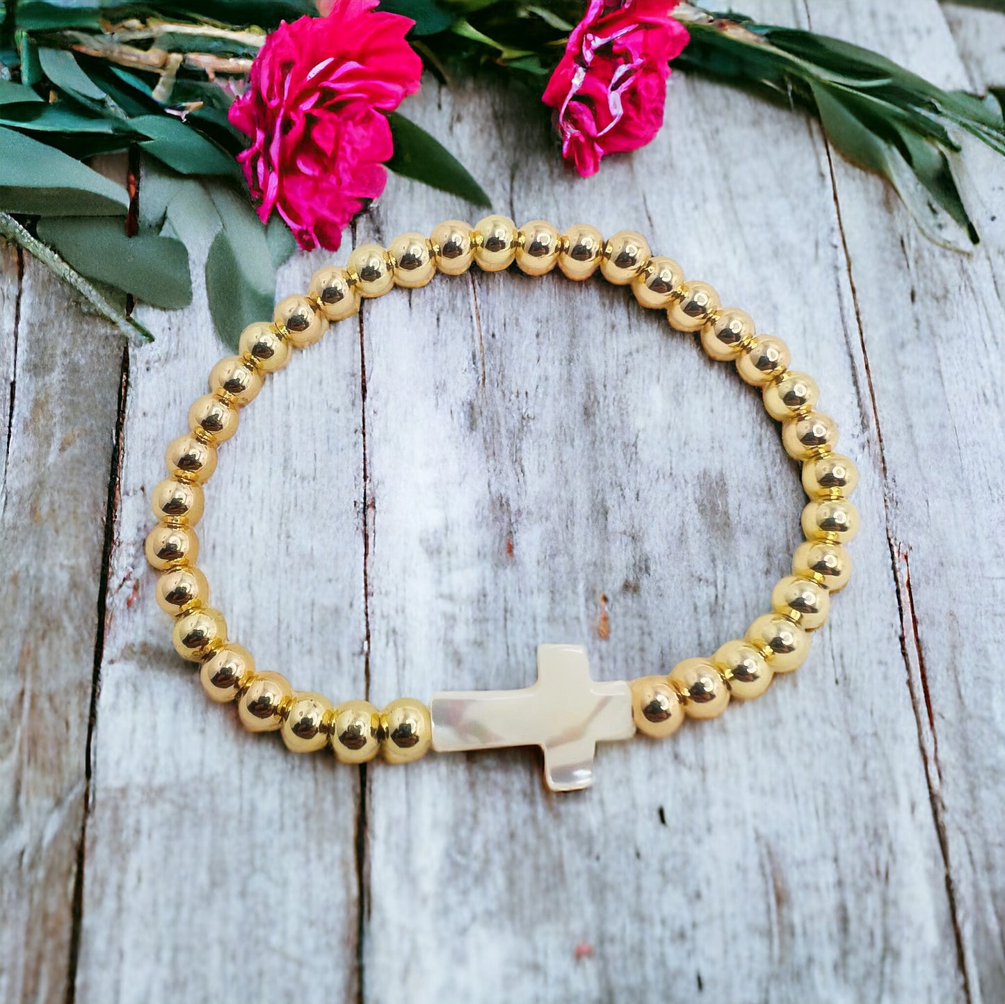 Gold bracelet with cross