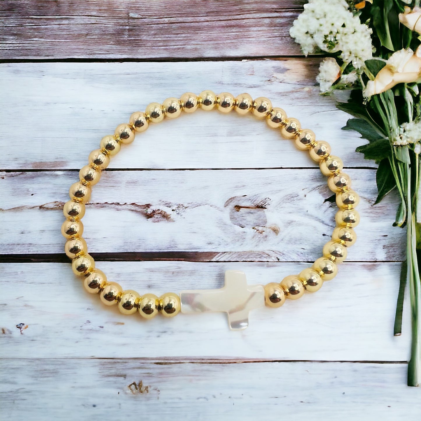 Gold bracelet with cross