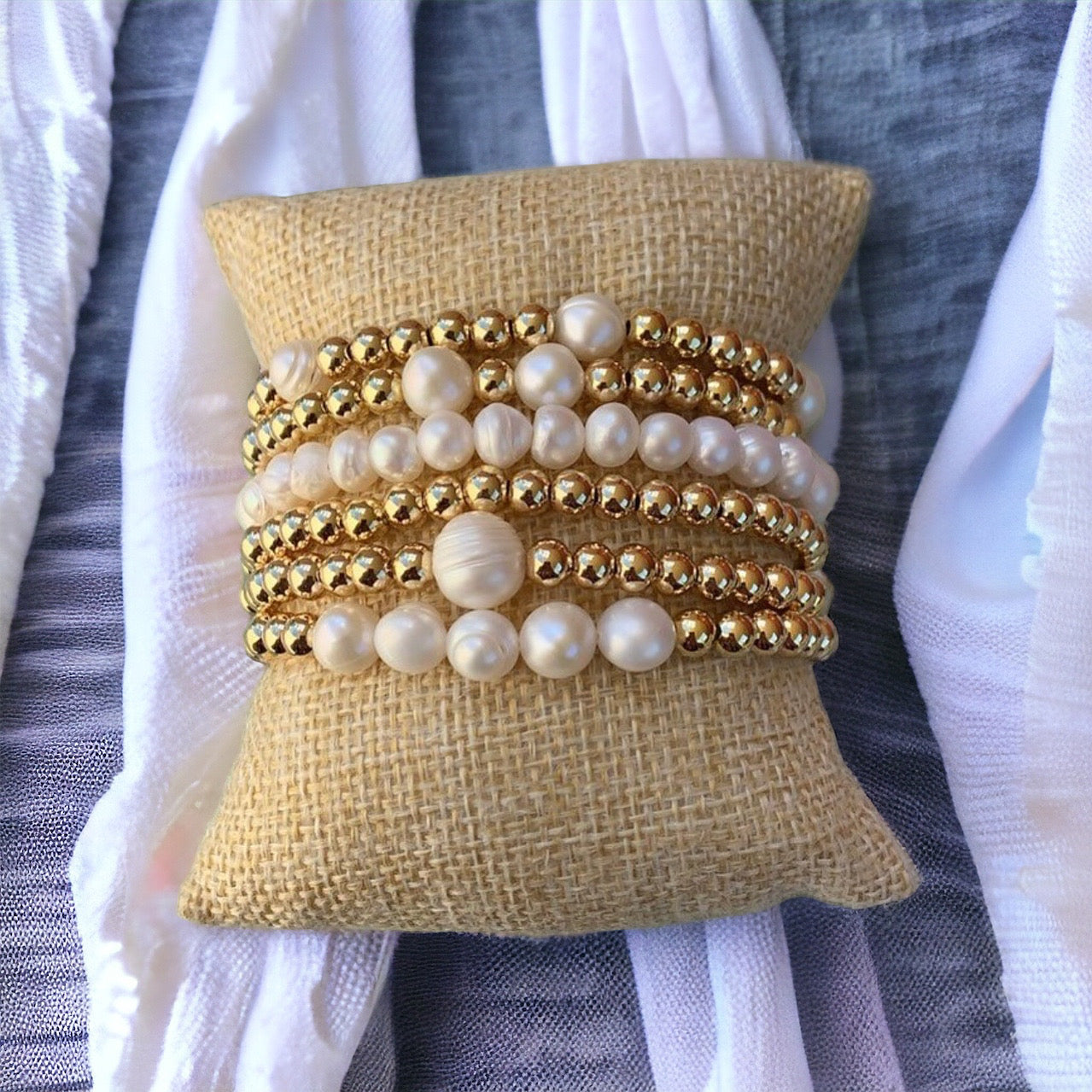 Stack of gold bracelets
