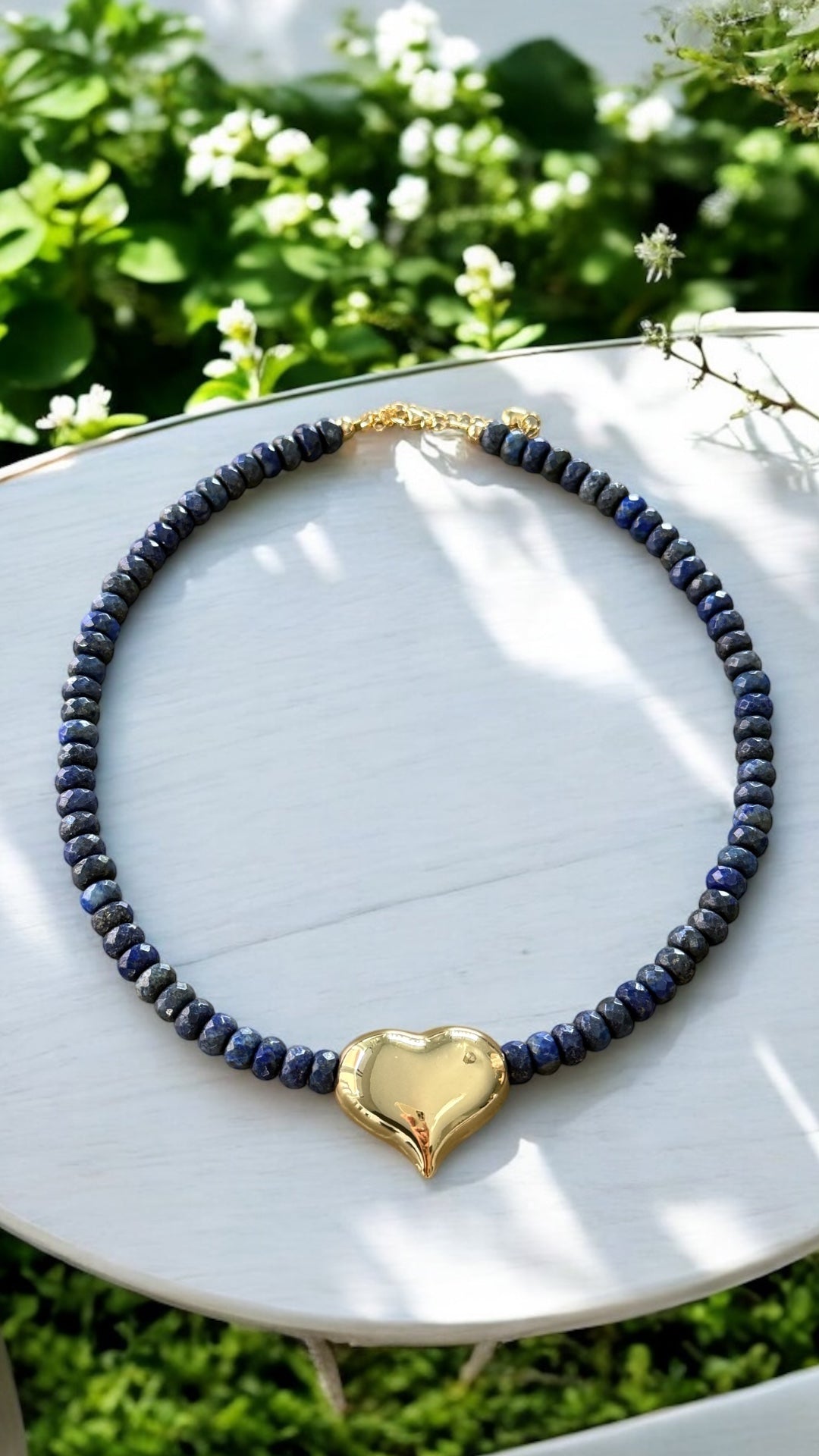 Blue necklace with gold heart