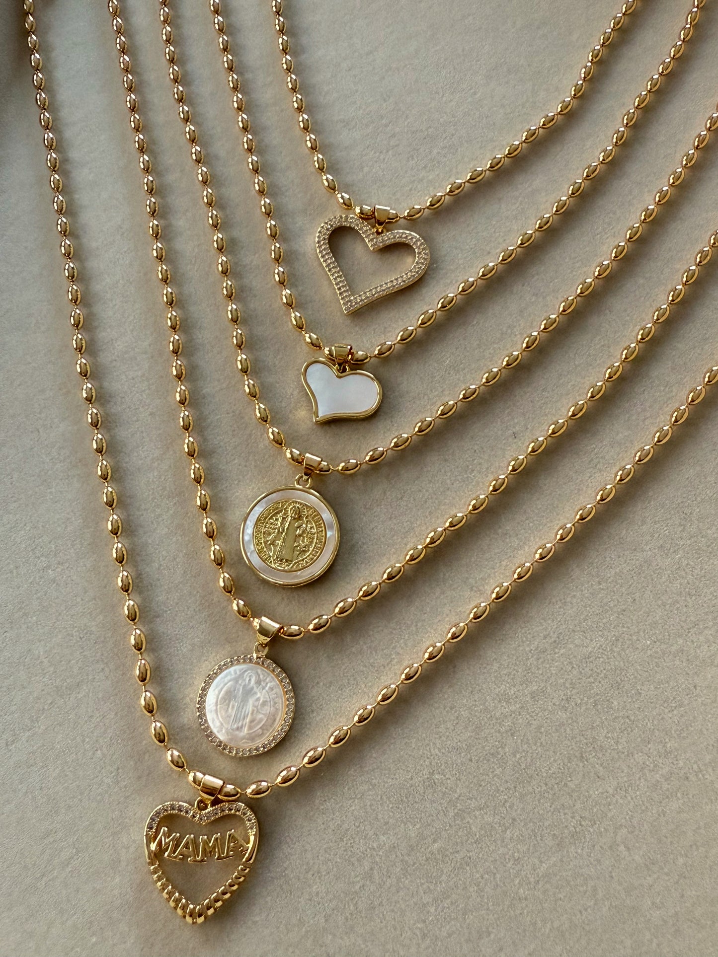 Gold necklaces with charm