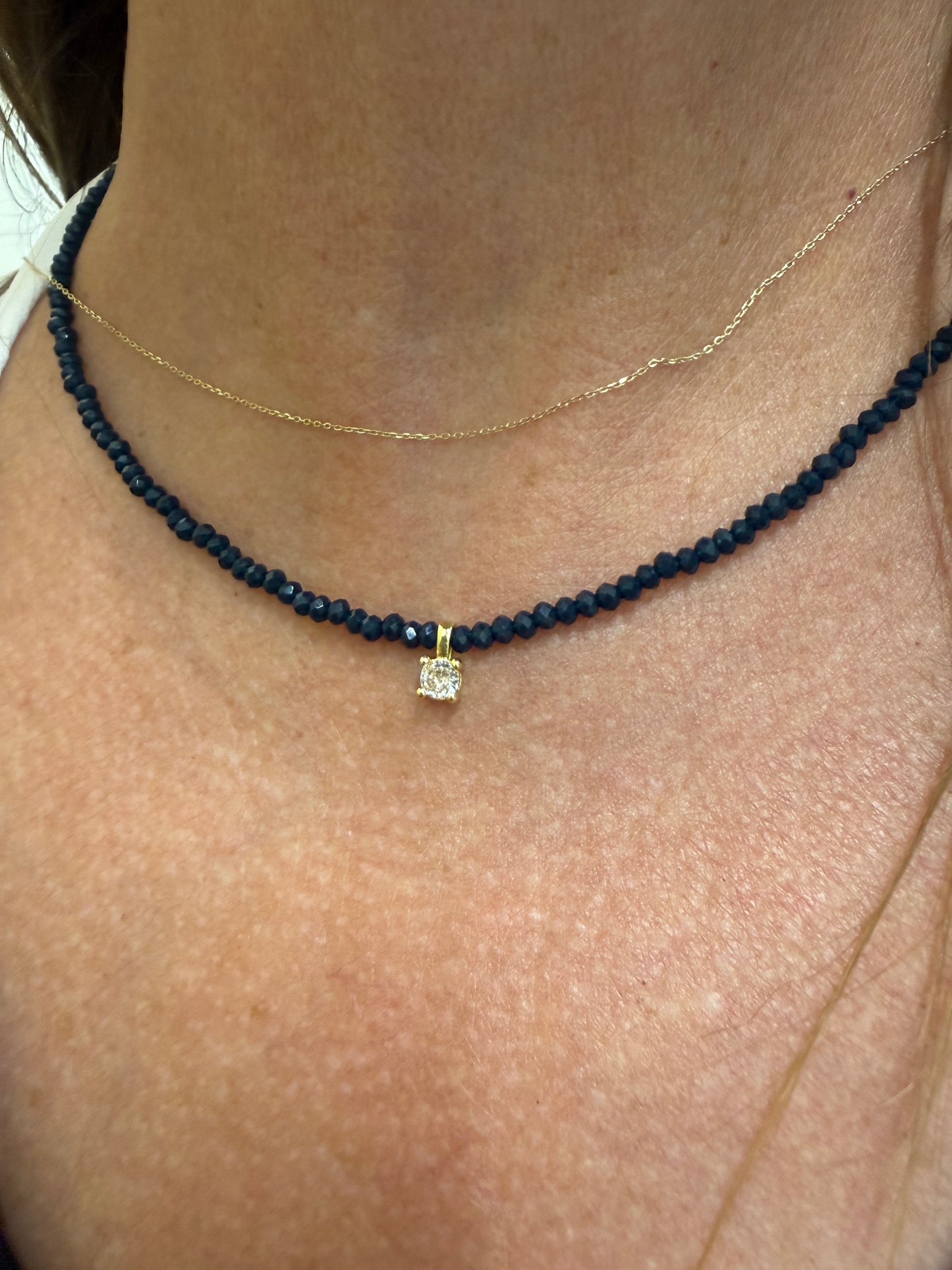 Midnight Blue Beaded Necklace with Gold Crystal Charm