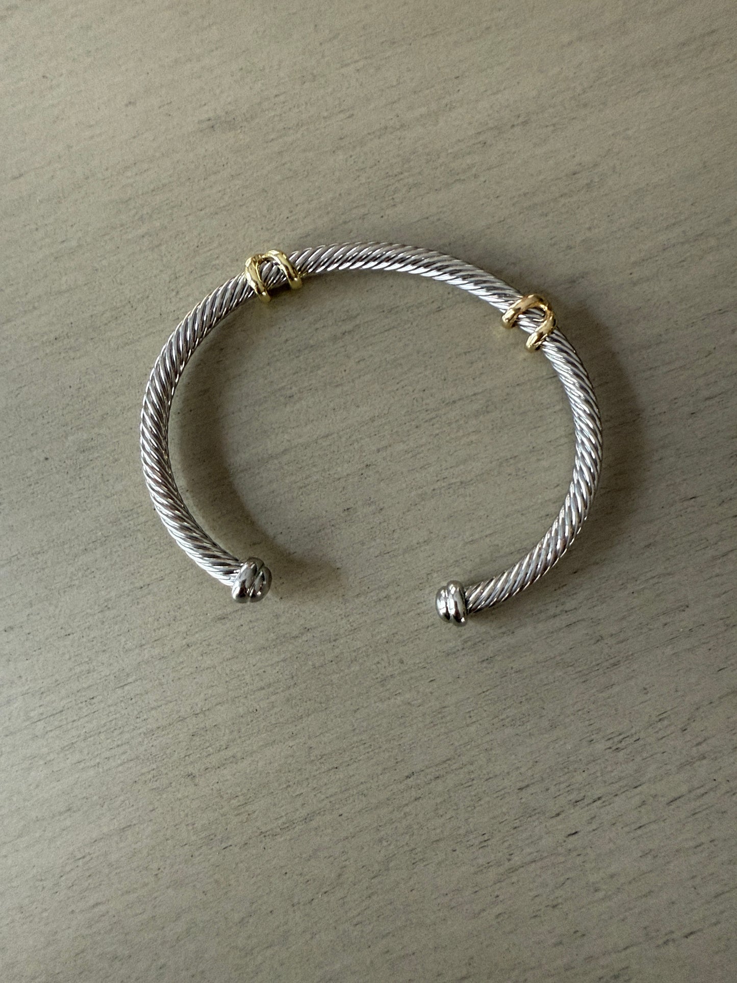 Silver cable cuff bracelet with gold accents