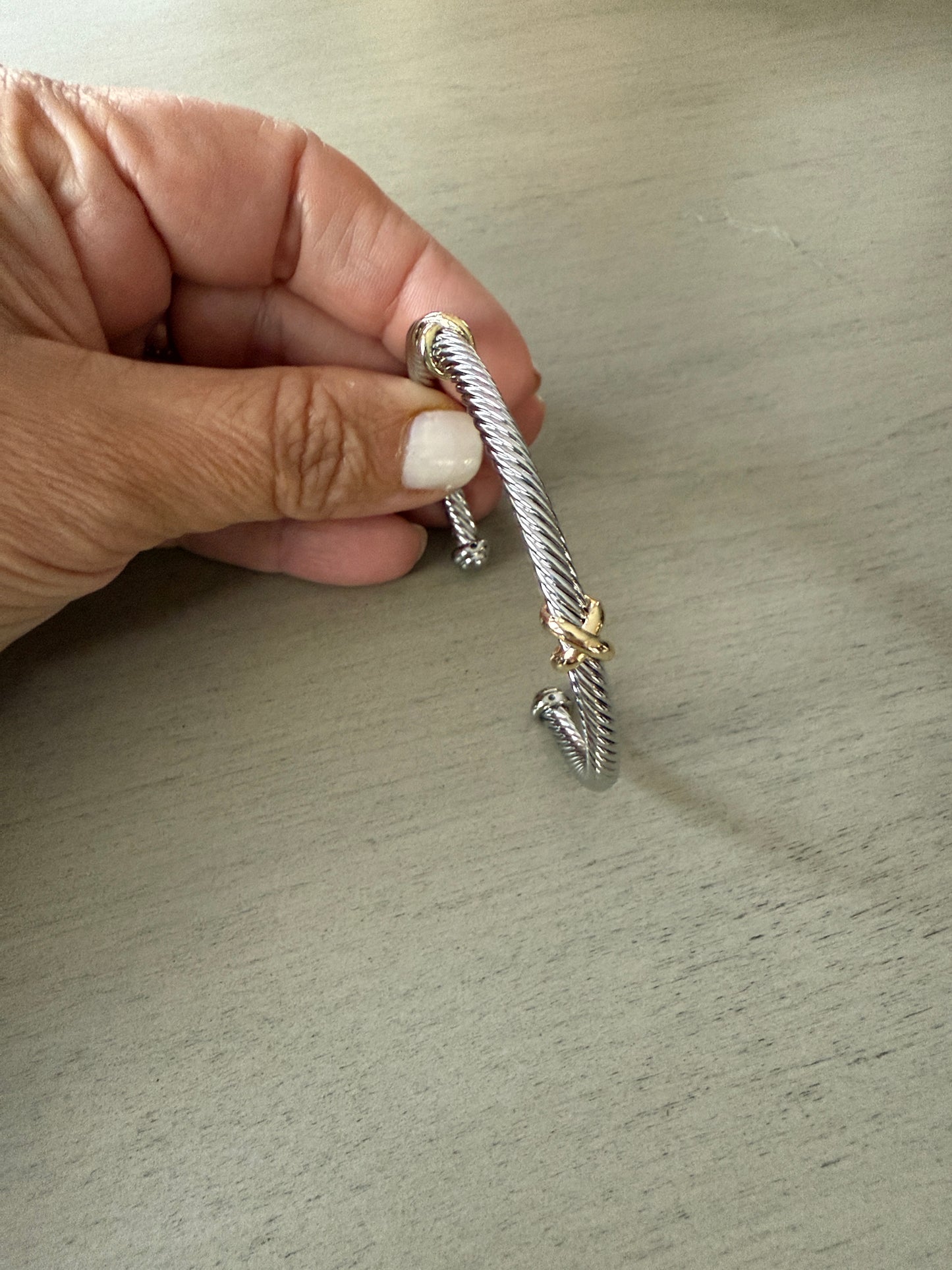 Silver cable cuff bracelet with gold accents