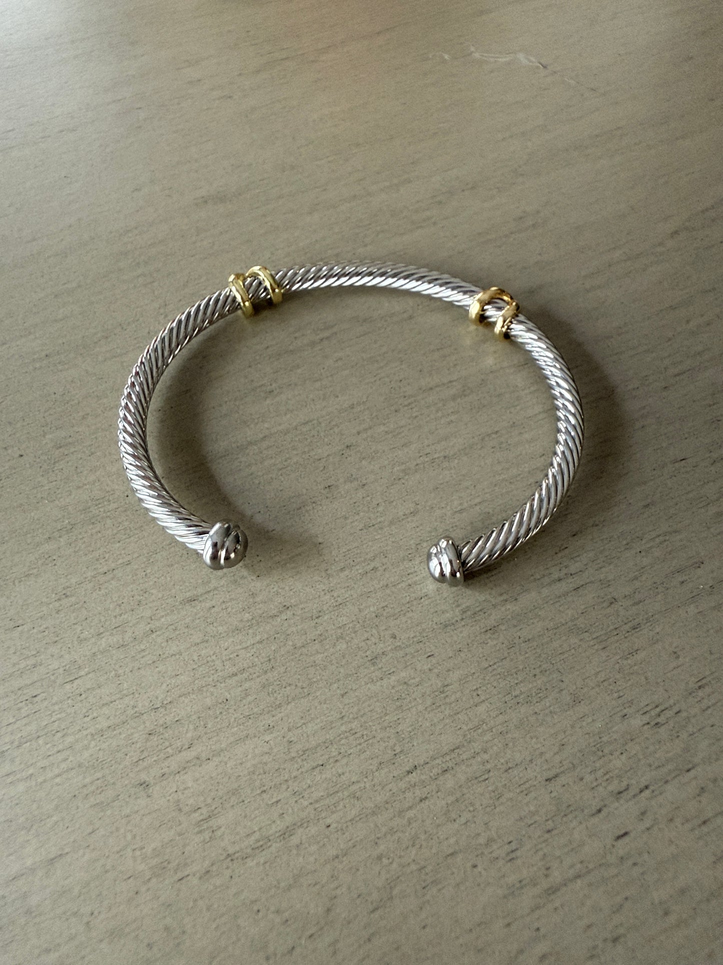 Silver cable cuff bracelet with gold accents