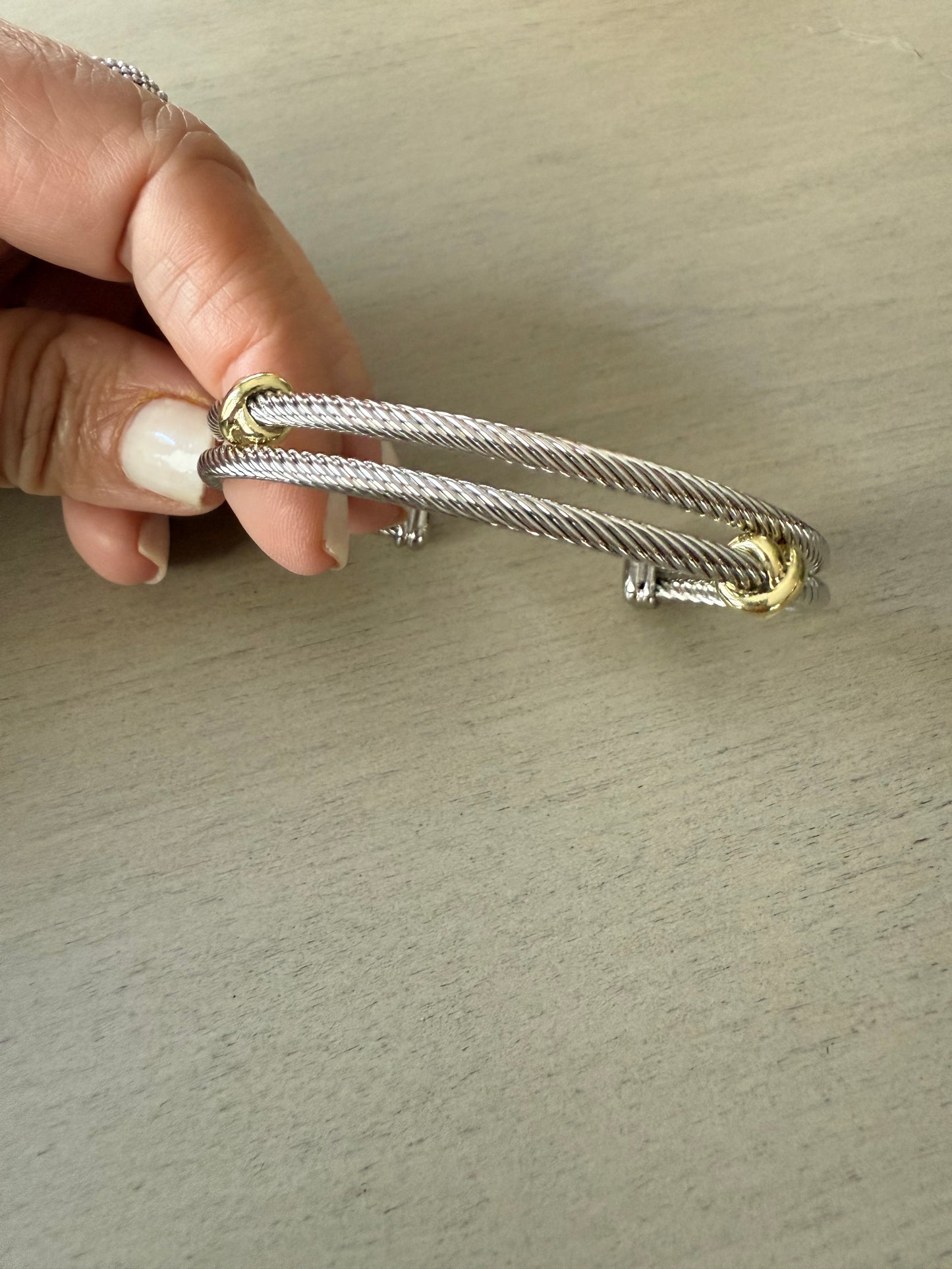 Elegant silver double bracelet with gold accents