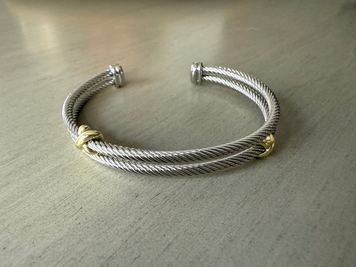 Elegant silver double bracelet with gold accents