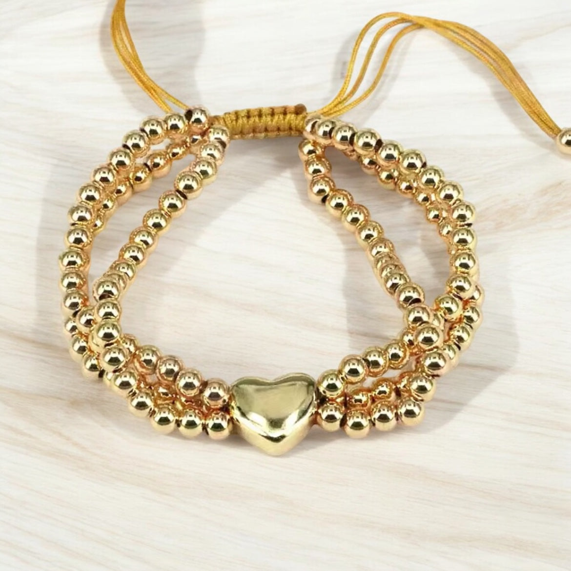 Gold adjustable bracelet with heart