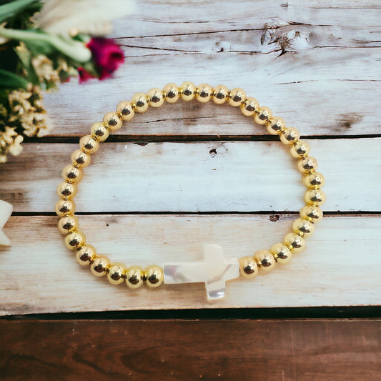 Gold bracelet with cross