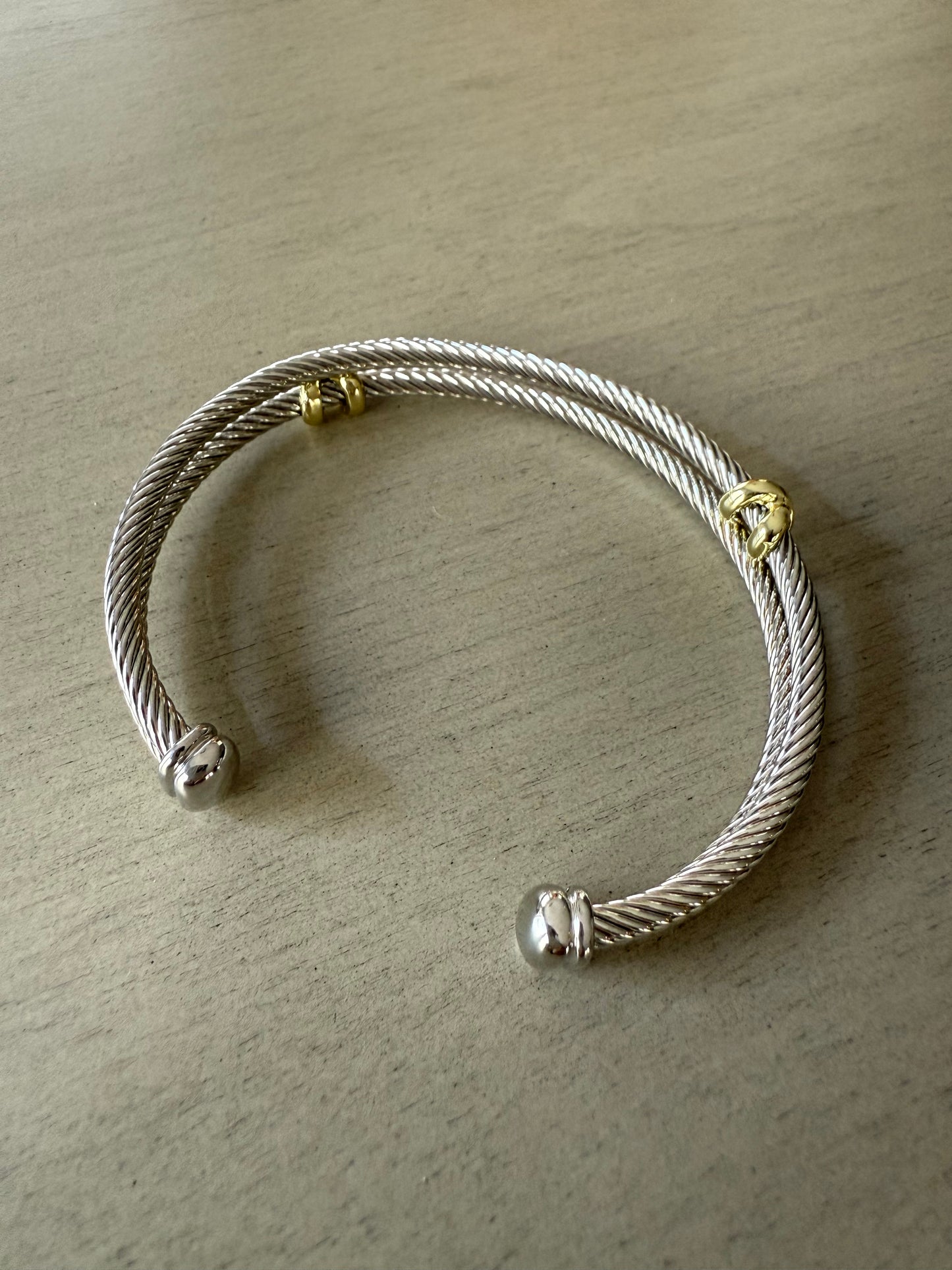 Elegant silver double bracelet with gold accents