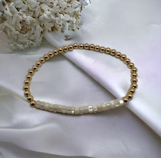 Gold bracelet with mother of pearl beads