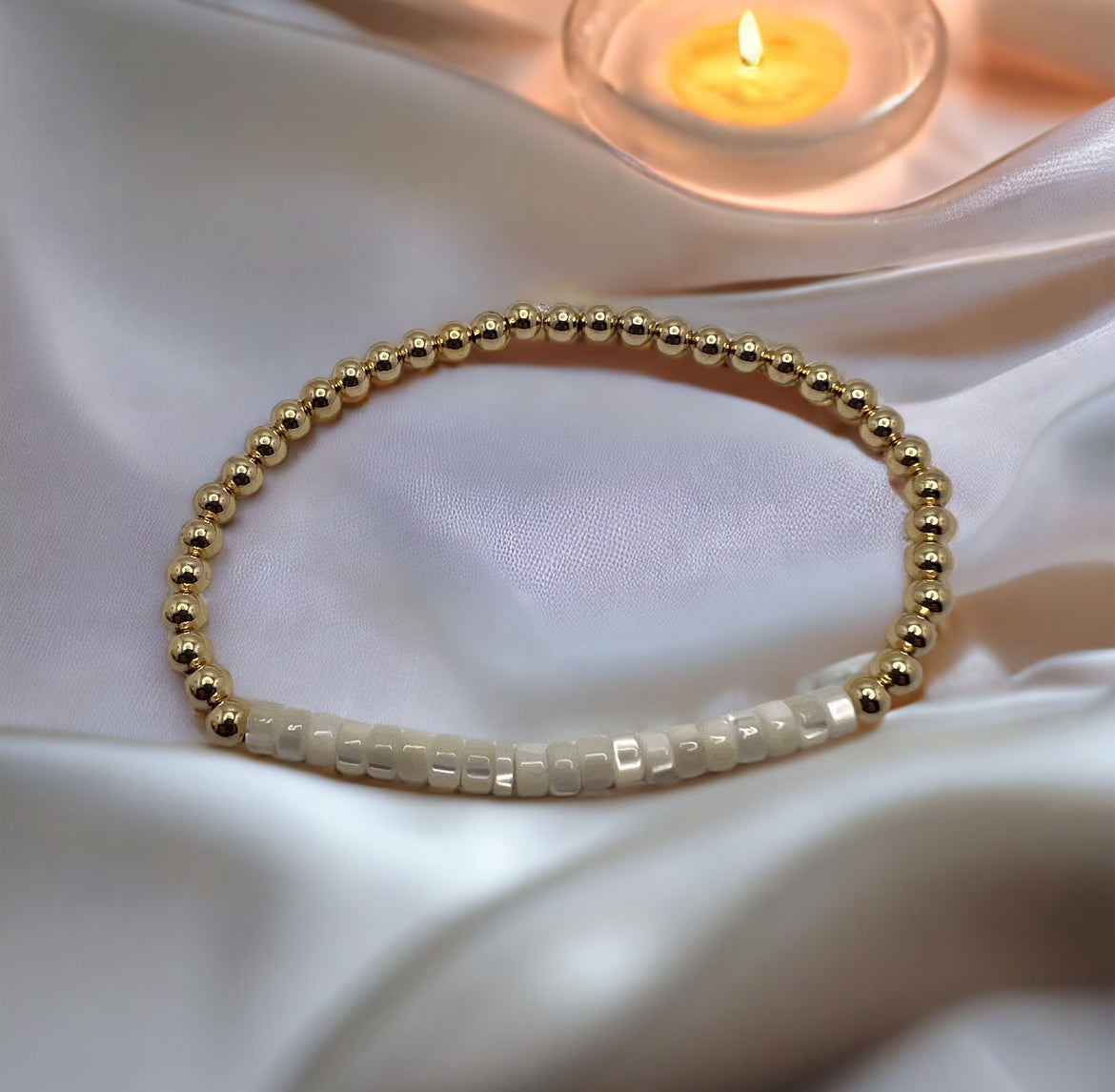 Gold bracelet with mother of pearl beads