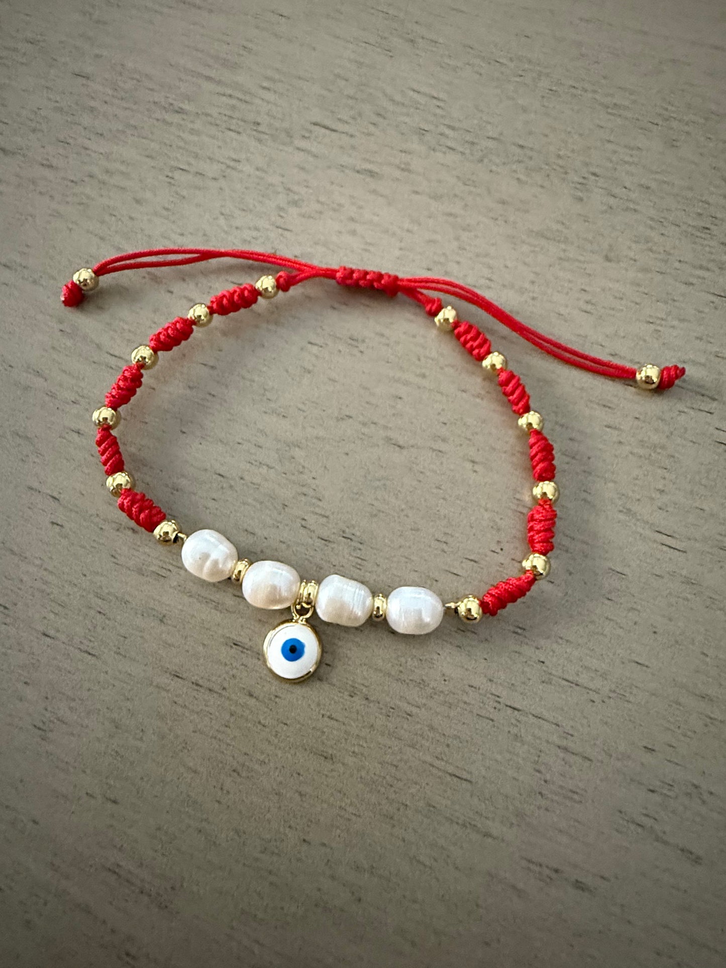 Red cord evil eye