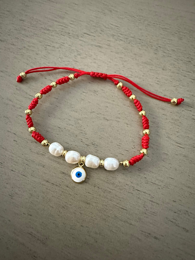 Red cord evil eye