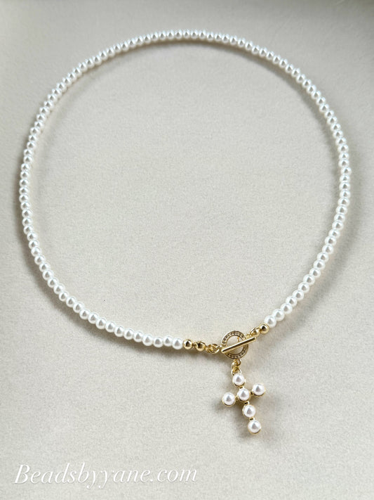 Dainty pearl necklace with cross