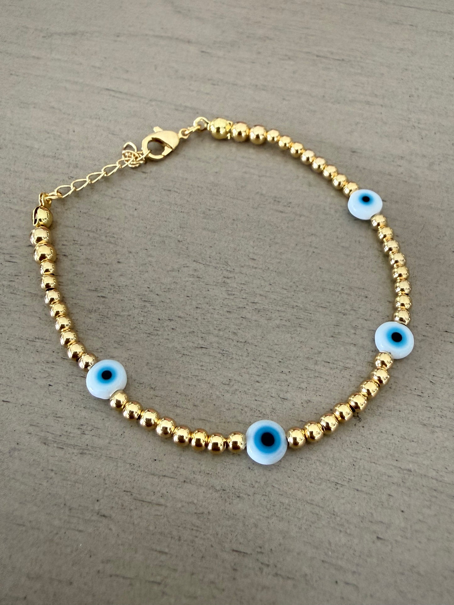 Blue Evil Eye Gold Beaded Bracelet – Protection & Good Luck