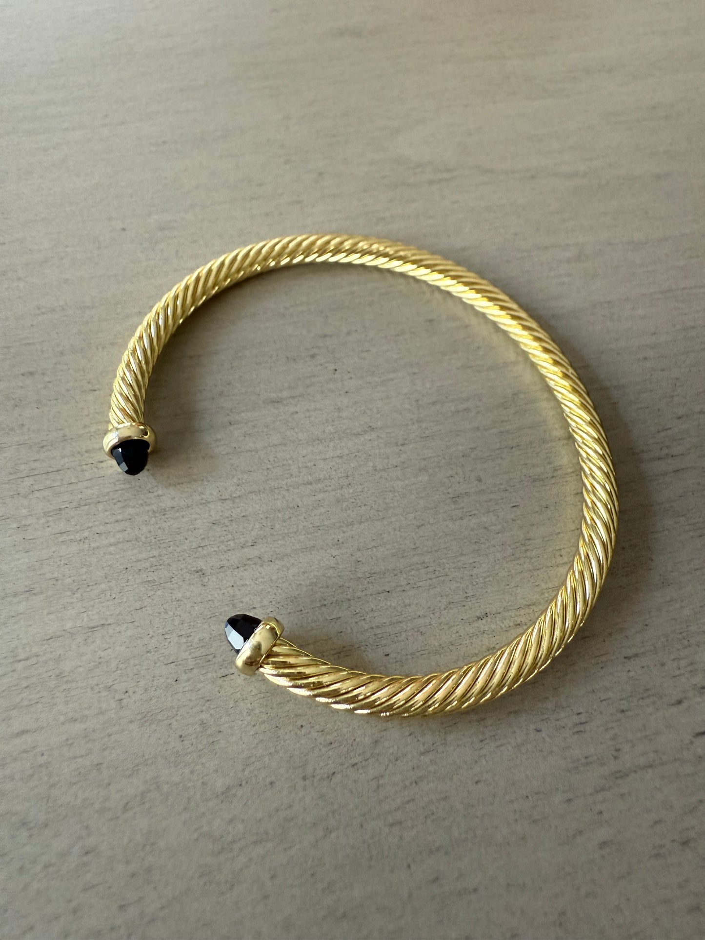 Gold Twist Cuff Bracelet with Black Stone Tips